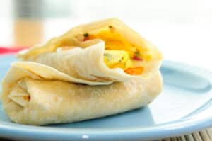 A scrambled egg breakfast burrito dish
